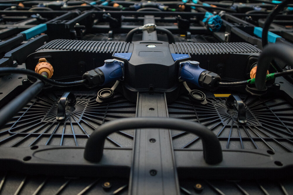 Detail of a rear portion of a LED LCD wall or stage panel. Display system for concerts, with visible rear panel with power and signal connectors visible.