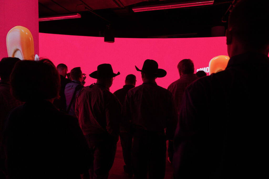 Farmers looking at LED Screen