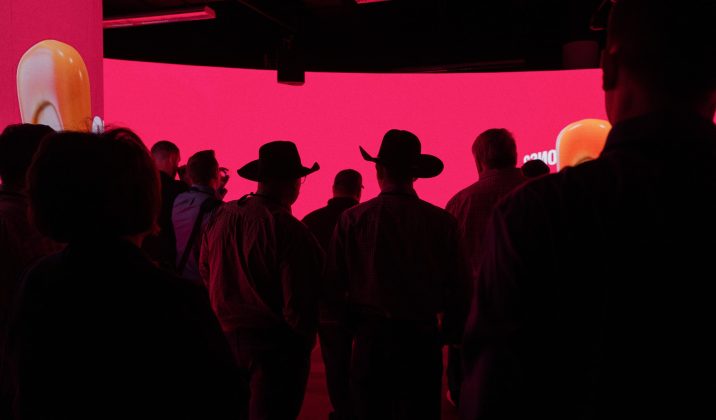 Farmers looking at LED Screen